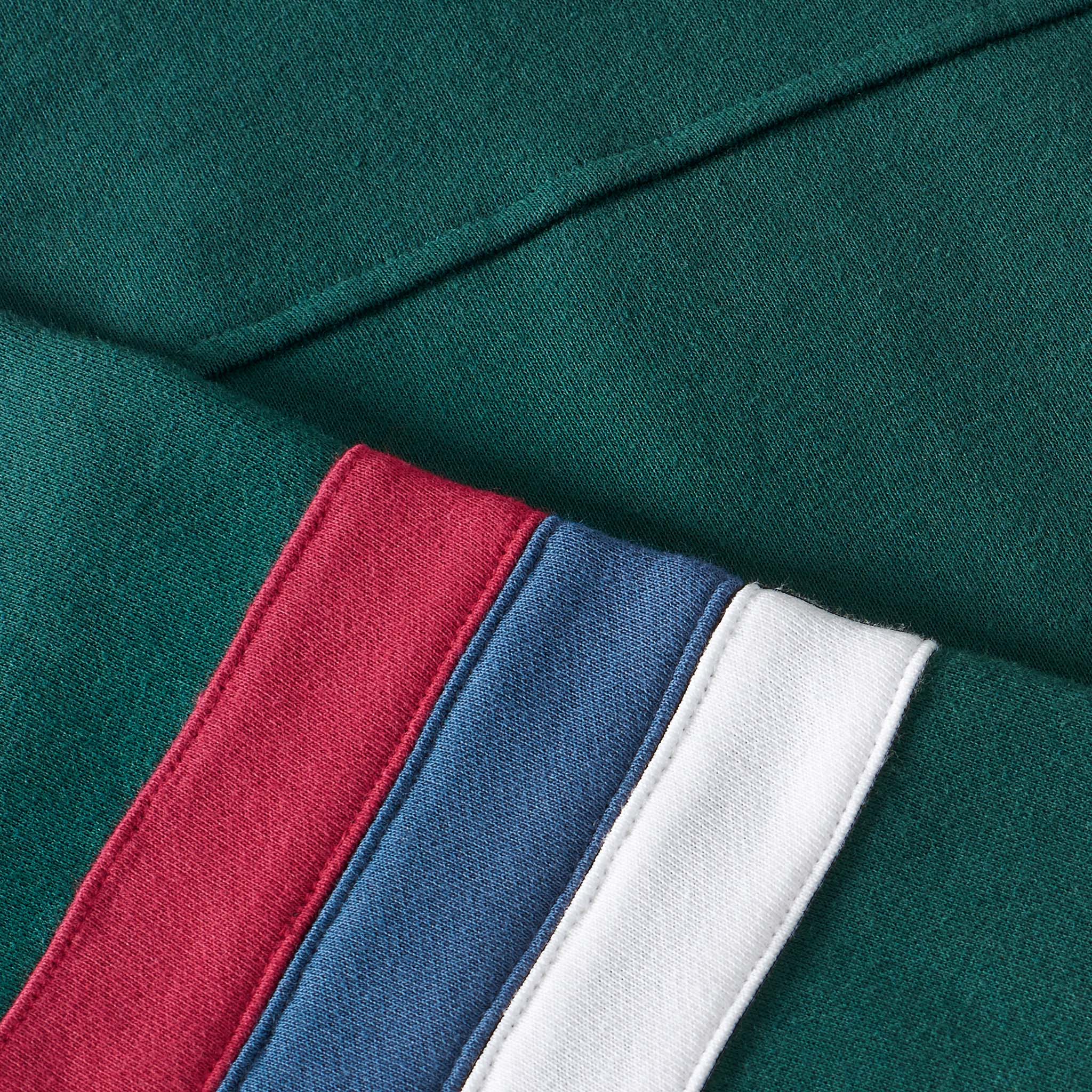 green hoodie with sleeve patch