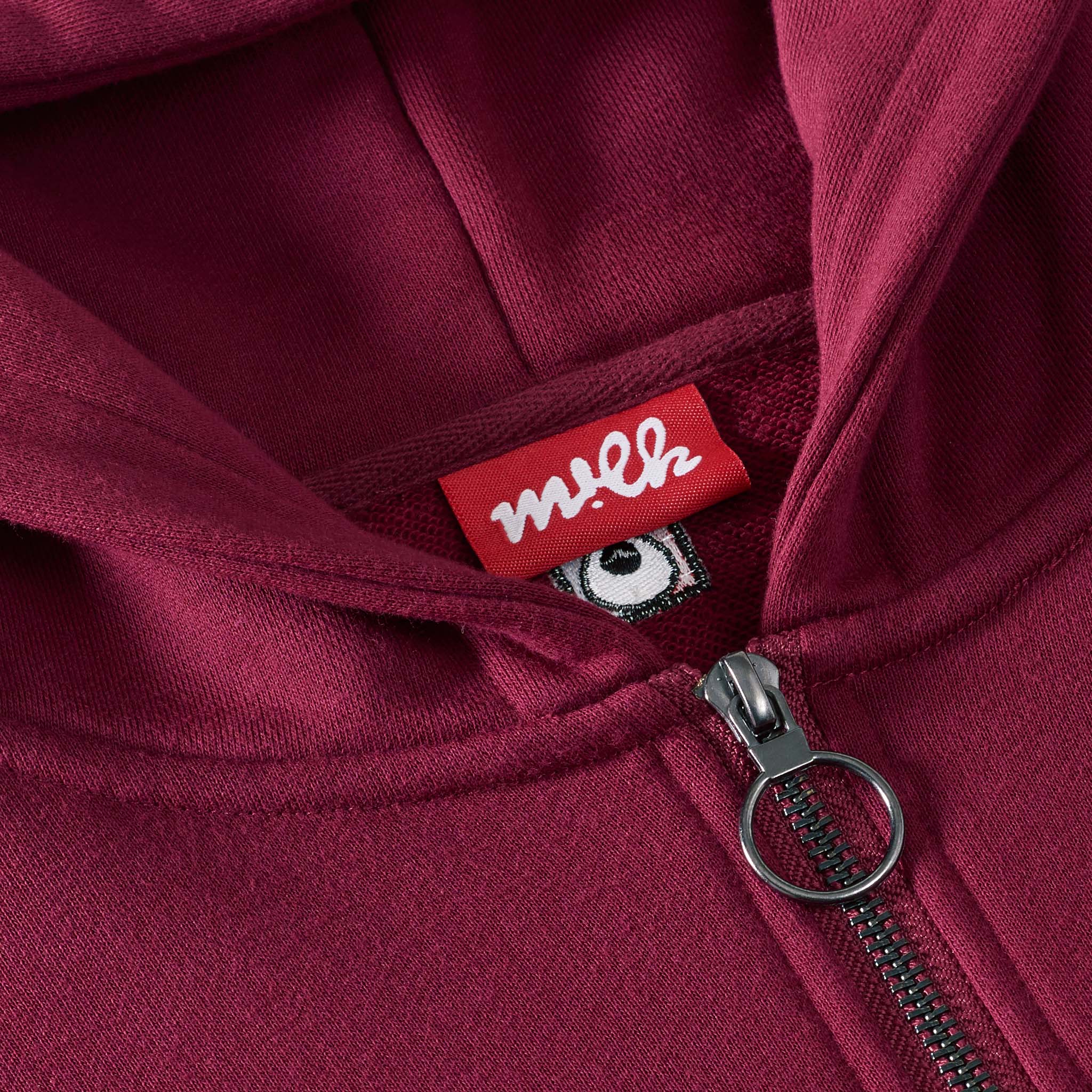 quarter zip hoodie with red label